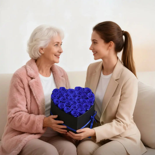 Two women holding a heart-shaped box of blue roses with text about lasting love and flower longevity.
