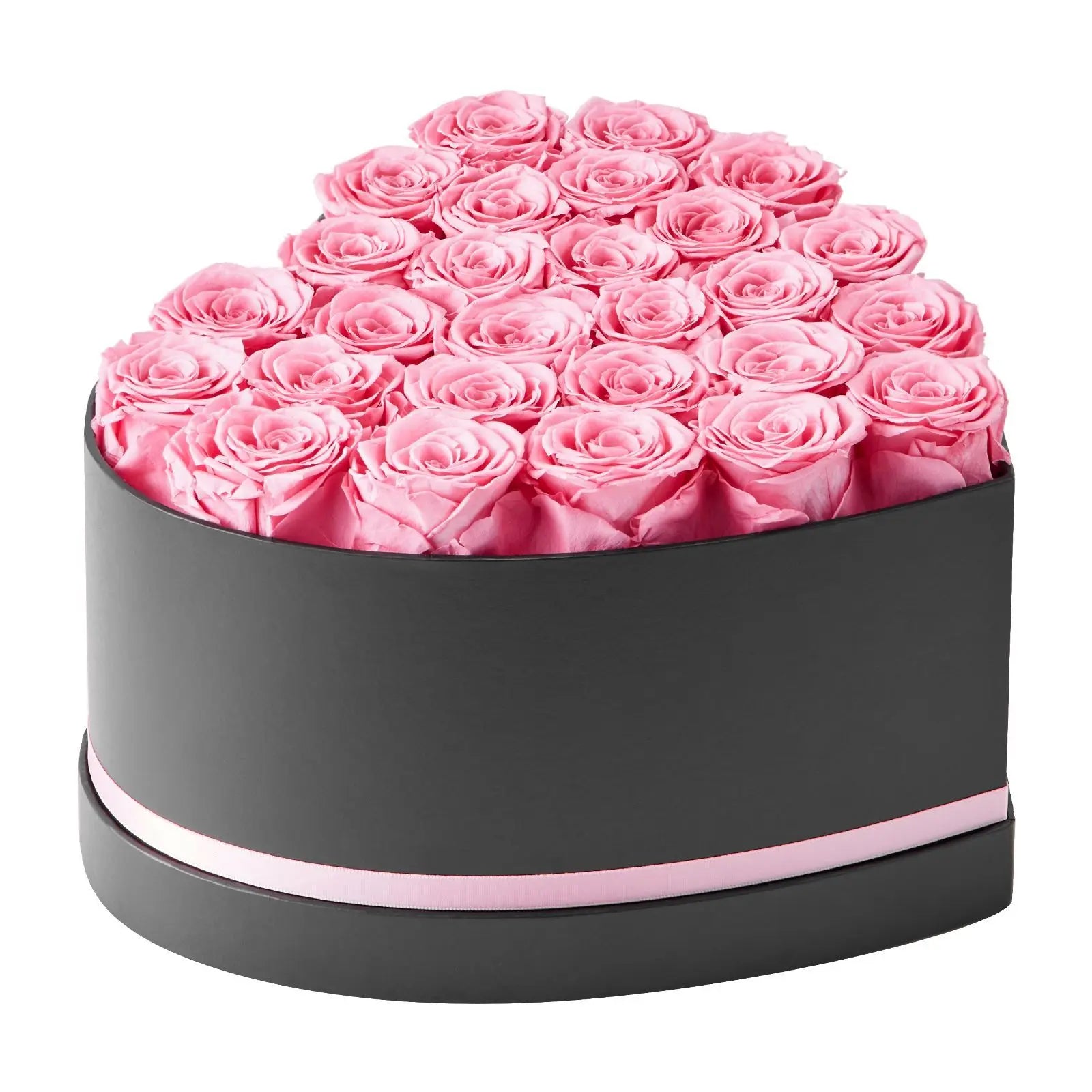 Heart-shaped box filled with pink roses on a white background